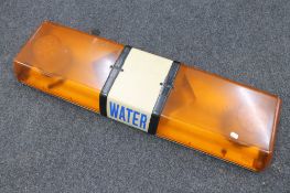 A vehicle roof top emergency light marked 'Water'
