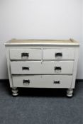 An antique painted pine four drawer press base