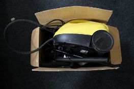 A boxed Karcher steam cleaner with accessories