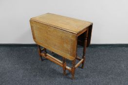 A 1930's oak gateleg table