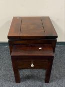 A nest of two hardwood tables one fitted a drawer