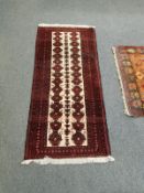 An Afghan Bokhara rug 81 cm x 182 cm