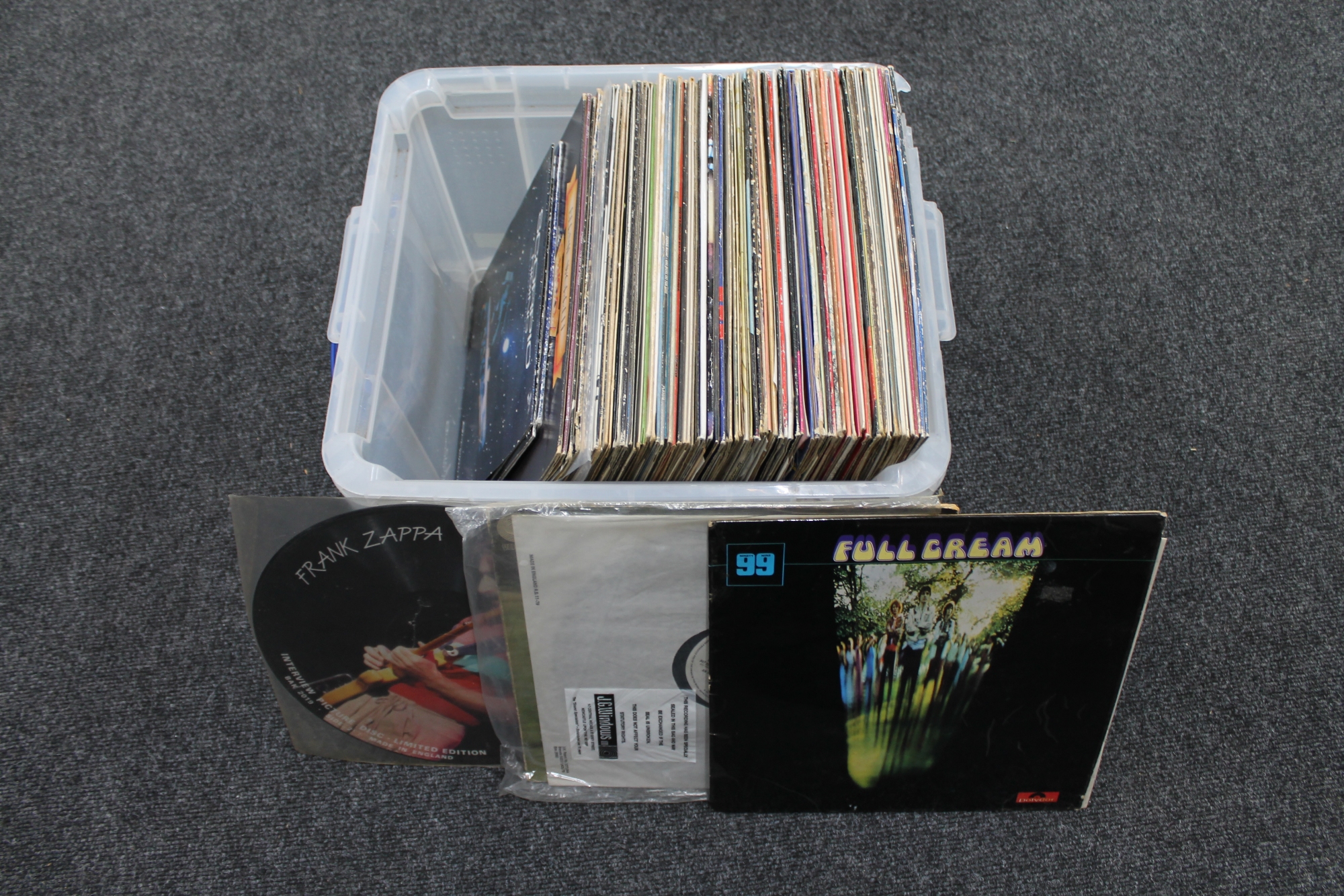 A plastic crate of LP's, rock and pop,