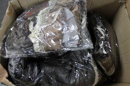 A box of Phaze faux leather skirts