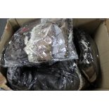 A box of Phaze faux leather skirts