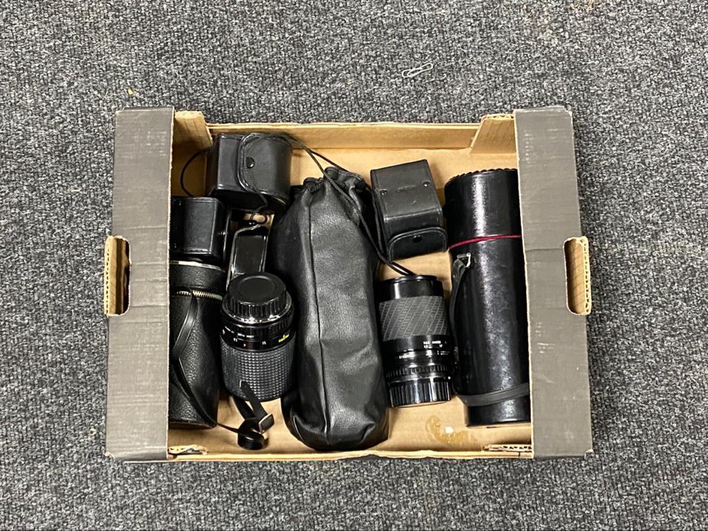 A box of camera lenses,