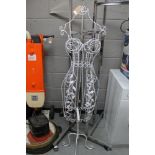 A wire metal mannequin together with a four-arm clothes rail