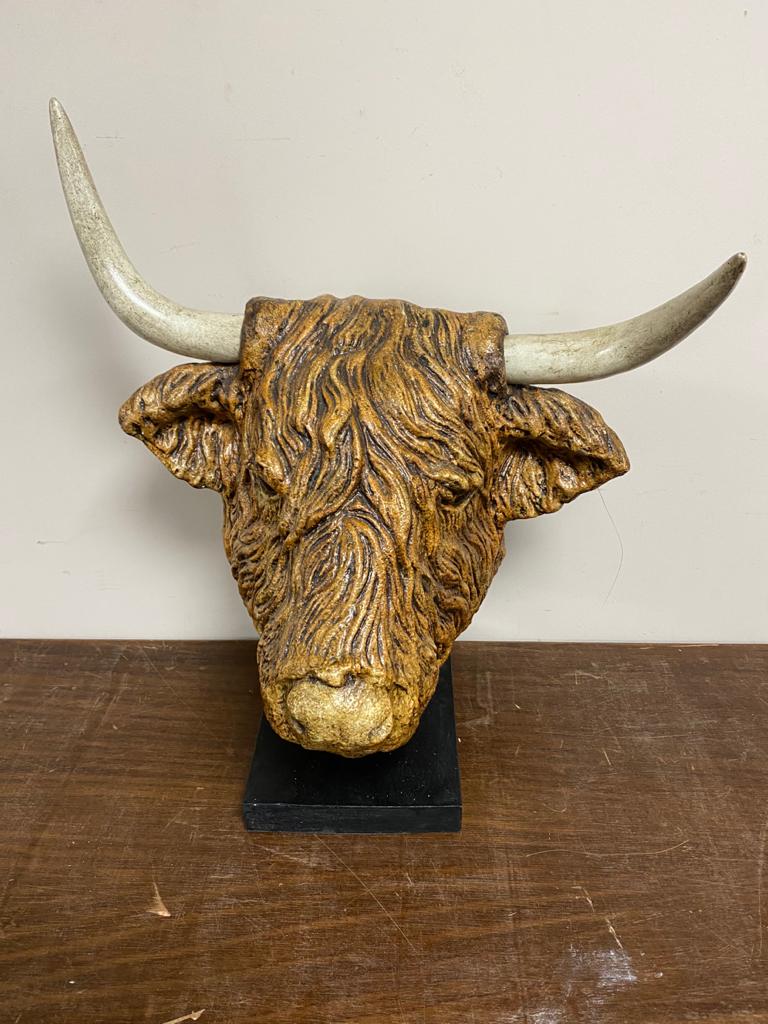 A contemporary composite highland bull's head on stand