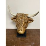 A contemporary composite highland bull's head on stand