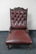 An Edwardian lady's chair in red buttoned leather