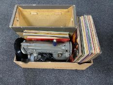 A box of cased mid century Singer sewing machine,