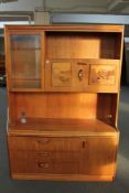 A mid century teak cocktail sideboard