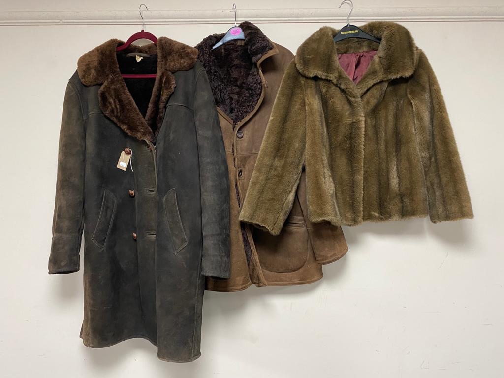 Two sheepskin jackets together with a faux fur lady's coat