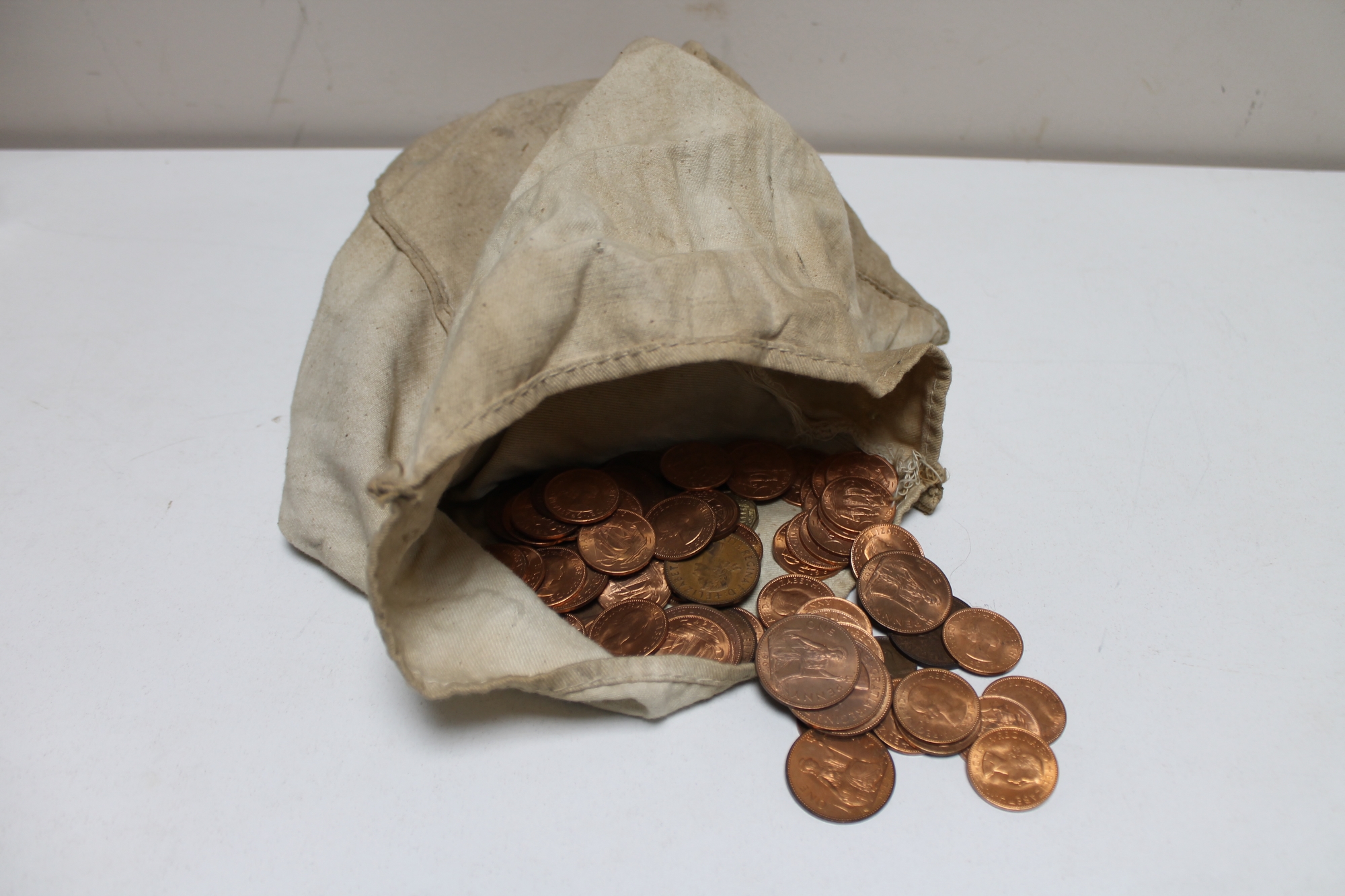 A bag of mid century pennies and half pennies