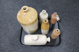 A tray of Gamble and Gilbert glazed stoneware flagon together with four further vintage bottles and