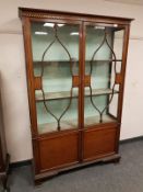 A late Victorian inlaid mahogany display cabinet,