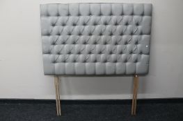 A 4'6 padded headboard in grey buttoned fabric