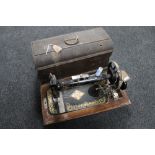 A cased 20th century New Home Companion sewing machine