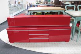 A two piece Ikea red high gloss entertainment stand