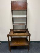 An oak two tier serving trolley together with a set of magazine shelves