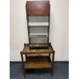 An oak two tier serving trolley together with a set of magazine shelves