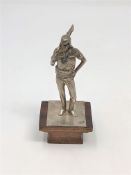 A solid silver Desert Forces figure on wooden plinth, London marks,