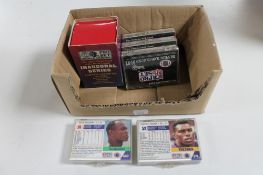 A box of 1990's pro set American football cards