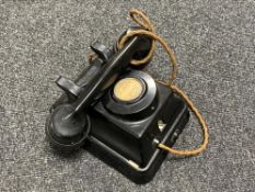 An antique Bakelite cased wall mounted telephone handset by Siemens Brothers,