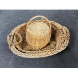 Two early 20th century wicker baskets and lidded hand basket