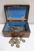 A Victorian walnut box with Chinese coins and tokens