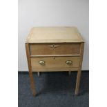 An antique pine clerks desk fitted with a drawer