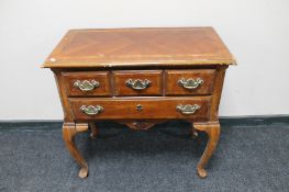 A reproduction low boy fitted with two drawers