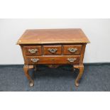 A reproduction low boy fitted with two drawers