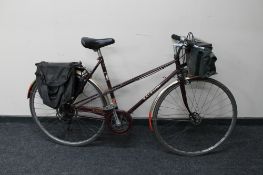 A lady's Raleigh Misty road bike with rear panniers