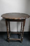 An Edwardian oak occasional table