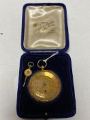 An 18ct gold cased fob watch with key, gross 48g.