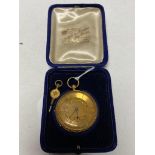 An 18ct gold cased fob watch with key, gross 48g.