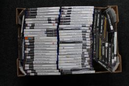 A box of Playstation and Playstation 2 games