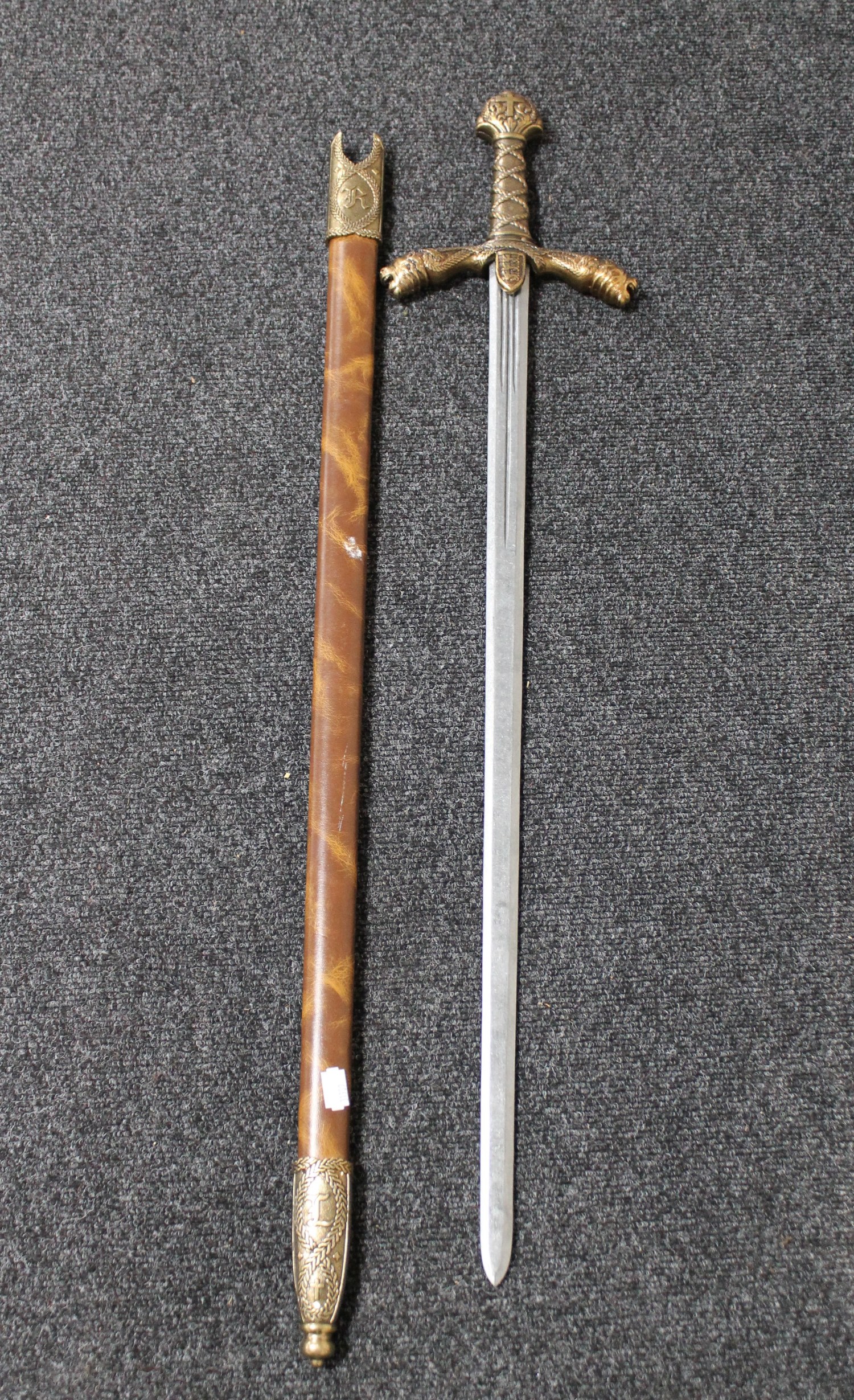 An ornamental ceremonial sword with lion mask handles