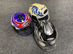 Three motorcycle helmets