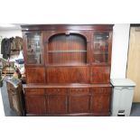 An inlaid mahogany Strongbow cocktail display unit fitted with cupboards and drawers beneath