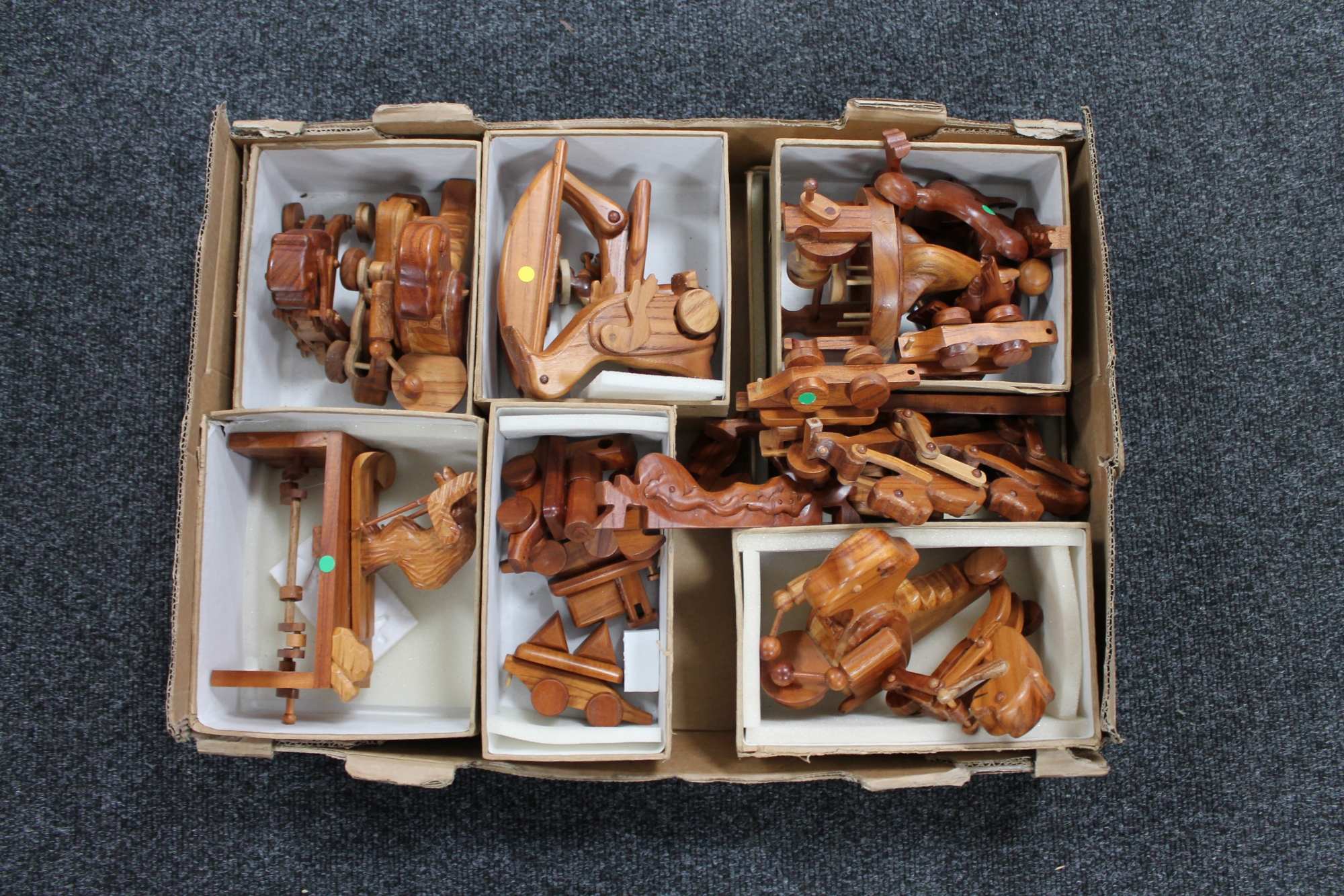 A box of wooden articulated toys