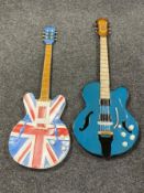 Two metal wall art guitars