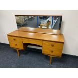 A mid century teak G-plan dressing table