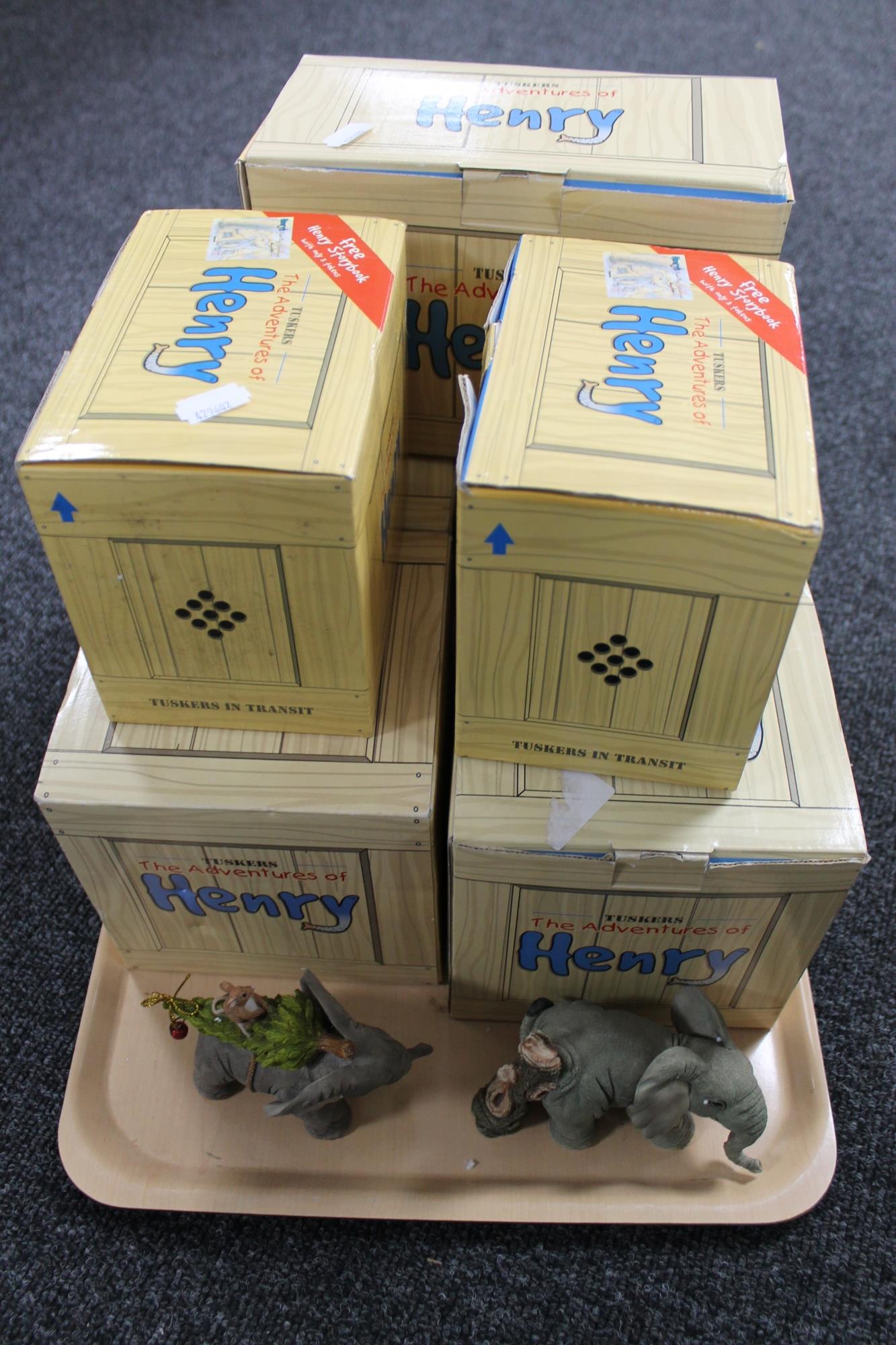 A tray of seven boxed Tuskers The Adventures of Henry figurines