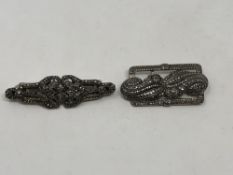 Two silver and marcasite brooches which each split into a pair of earrings (2)