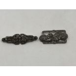 Two silver and marcasite brooches which each split into a pair of earrings (2)