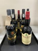 A tray of seven bottles of alcohol - Royal Oporto 1980 port,