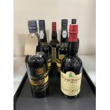 A tray of seven bottles of alcohol - Royal Oporto 1980 port,