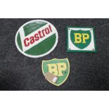 Three cast iron plaques - Two BP and Castrol